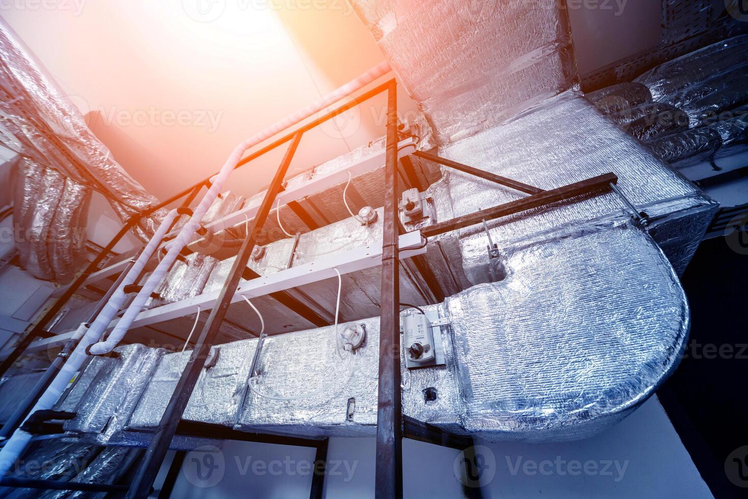 Ventilation pipe system indoors. Modern Industrial background. photo