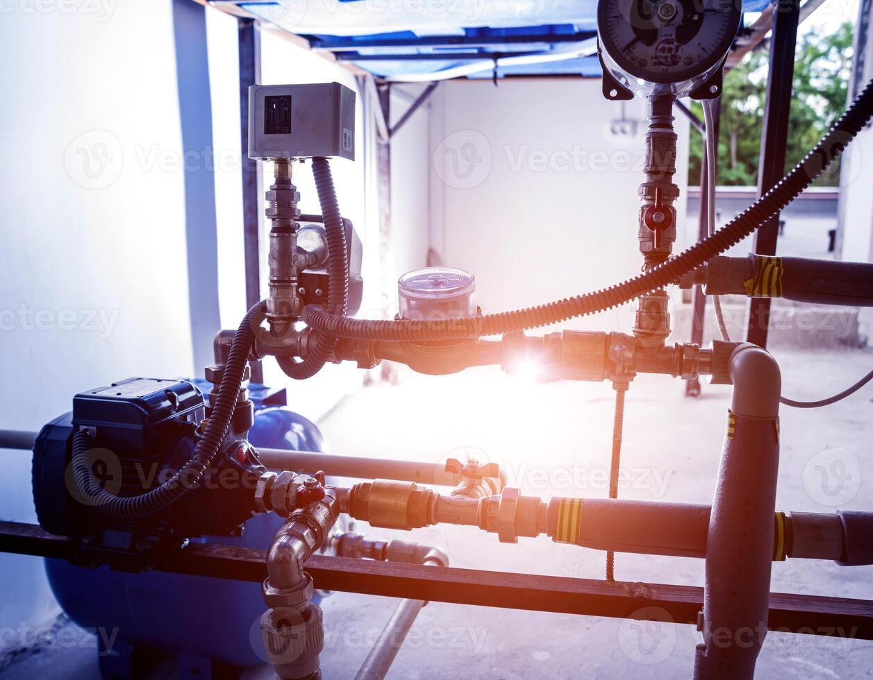 Technician checking water system nodes.Modern Industrial background photo