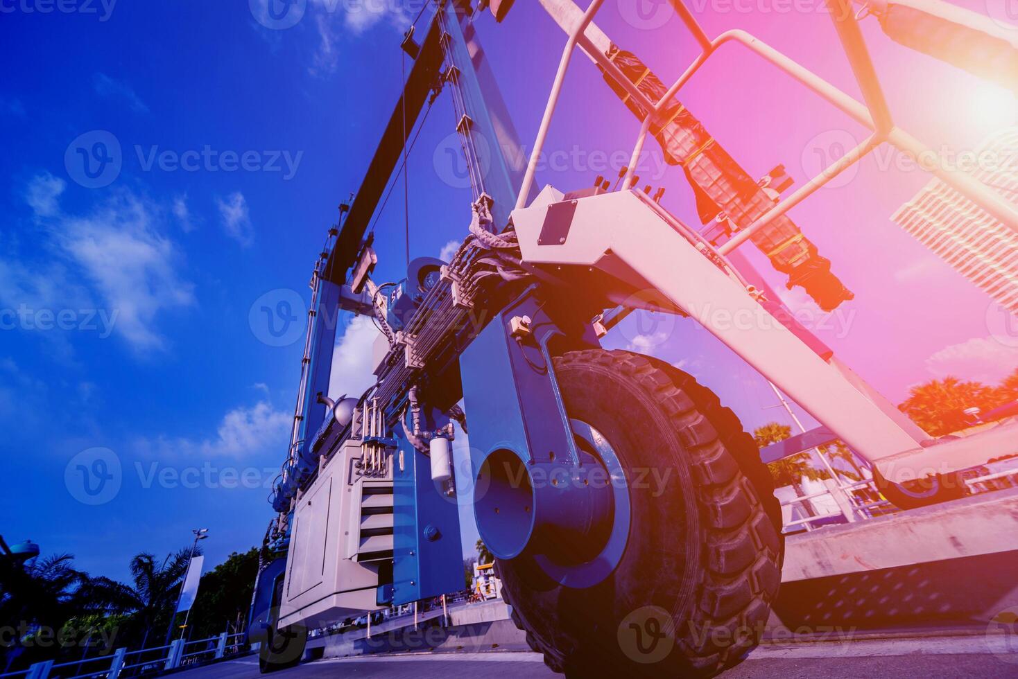 Lifting crane for elevating boat at harbor docks. photo