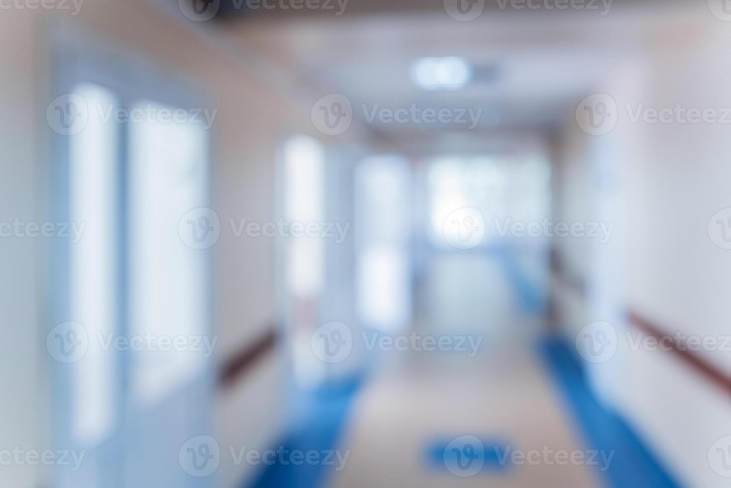 Bloored empty long corridor in the modern clinic. photo