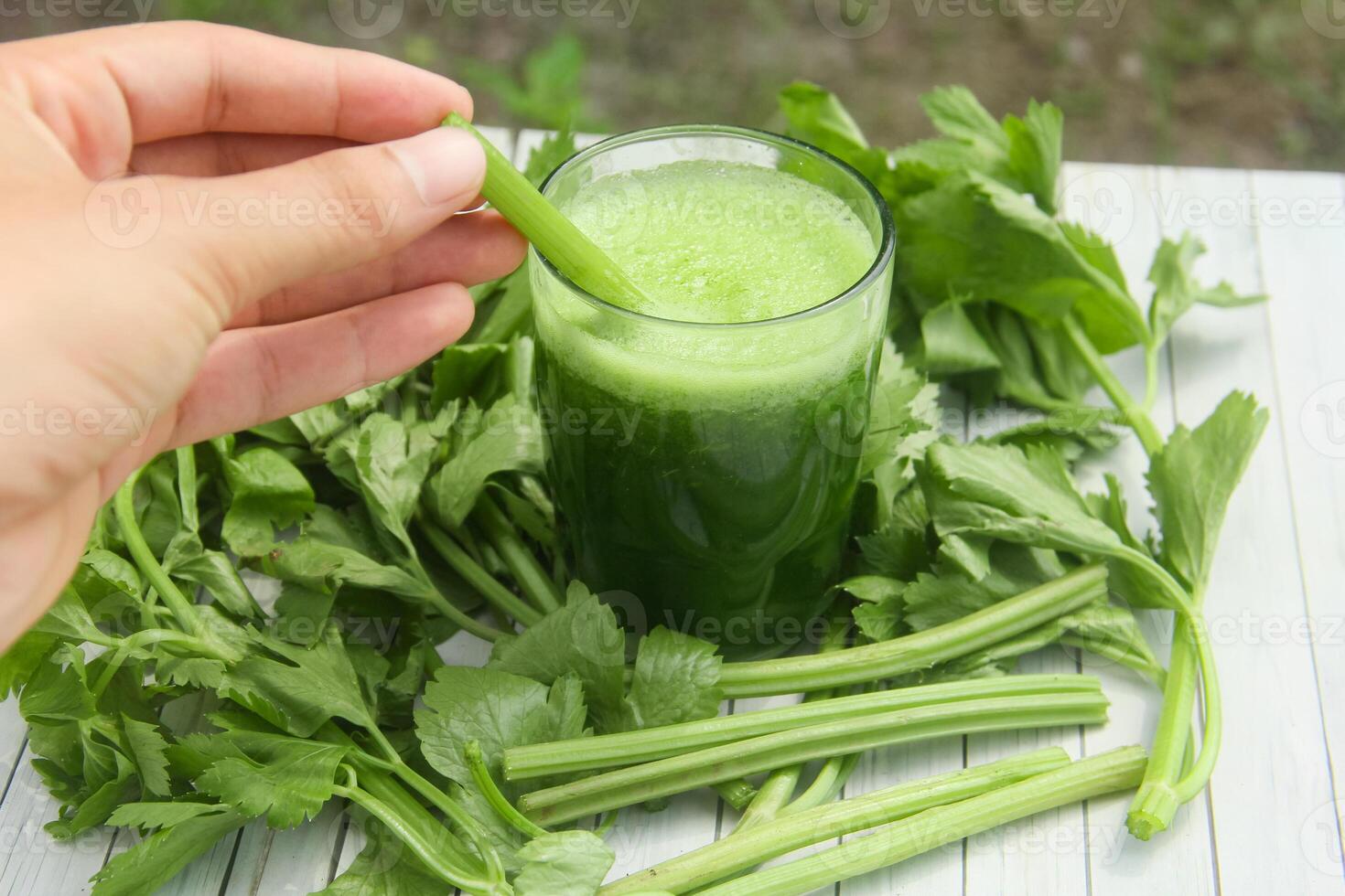 Celery juice, healthy green drink made from celery photo