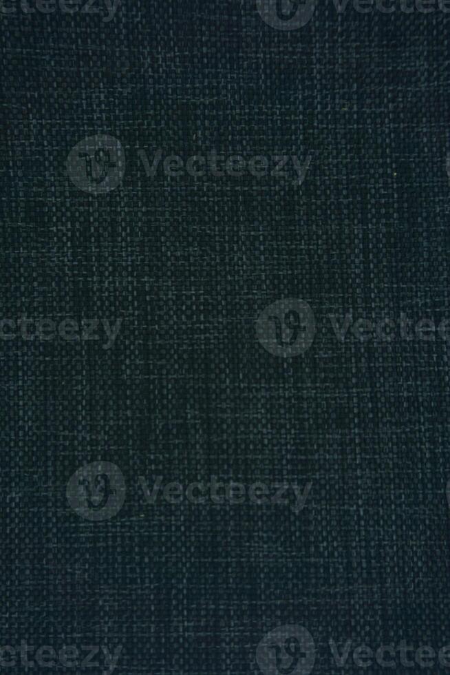 Textured Fabric Surface with Dark Tones Perfect for Design Projects photo