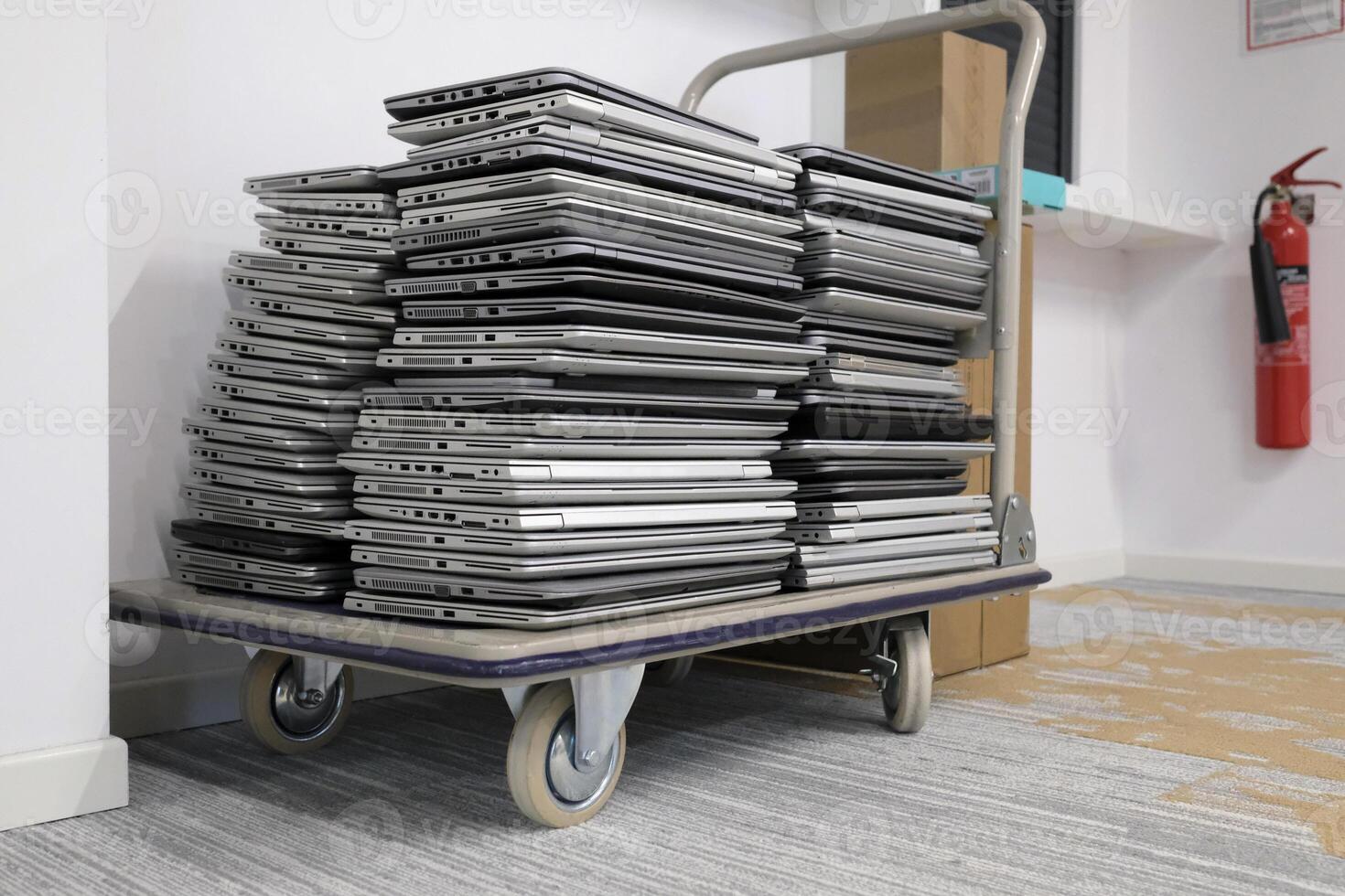 E-waste - stack of laptops to be discarded photo