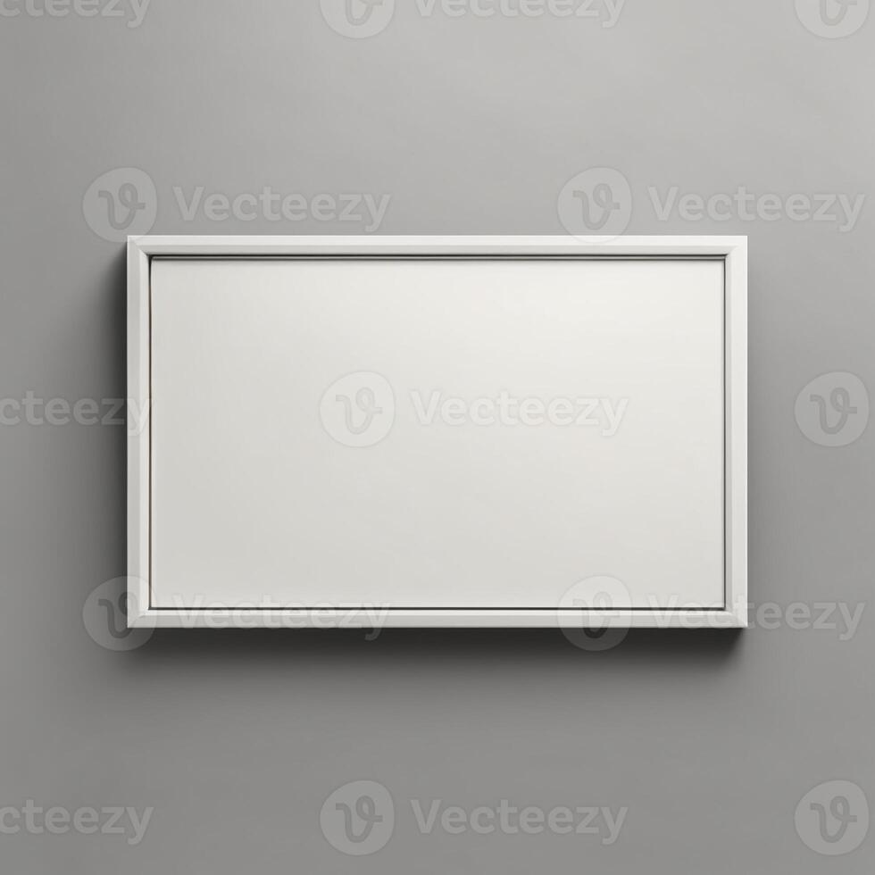 Blank white frame on a gray wall photo