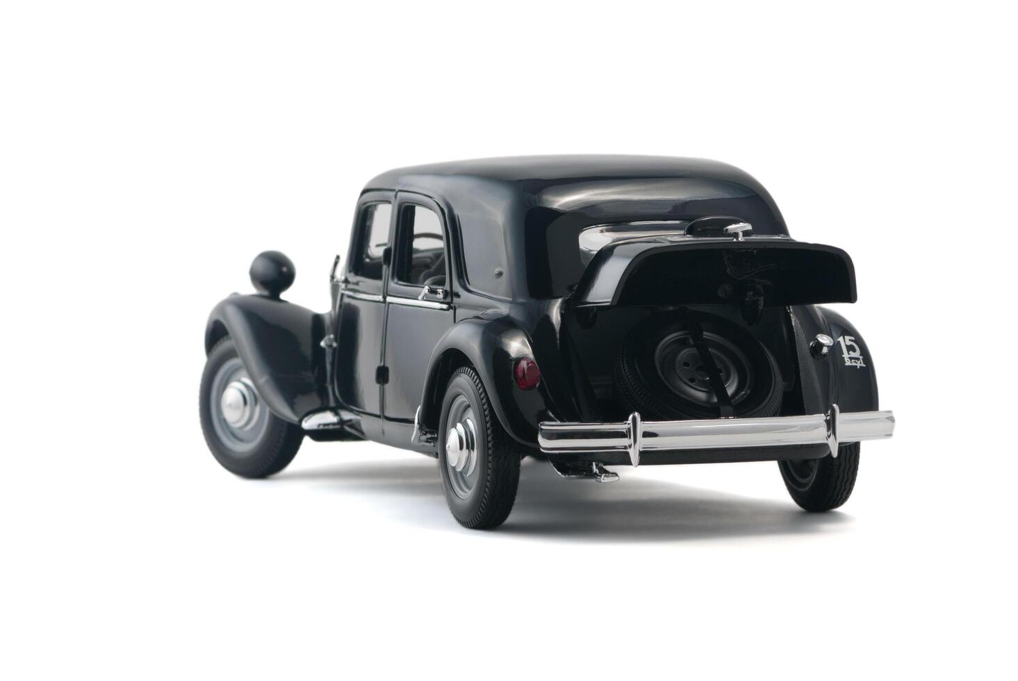 ALMATY, KAZAKHSTAN - FEBRUARY 23, 2014 Black vintage retro car with an open trunk isolated on white background photo