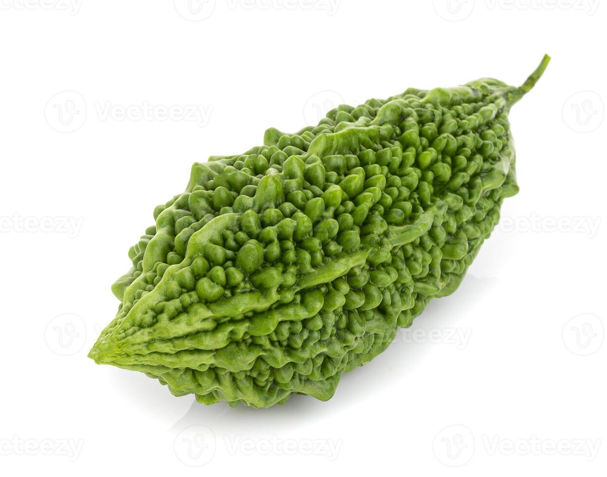 Fresh bitter gourd Bitter cucumber or bitter melon with cut slice isolated on a white background photo