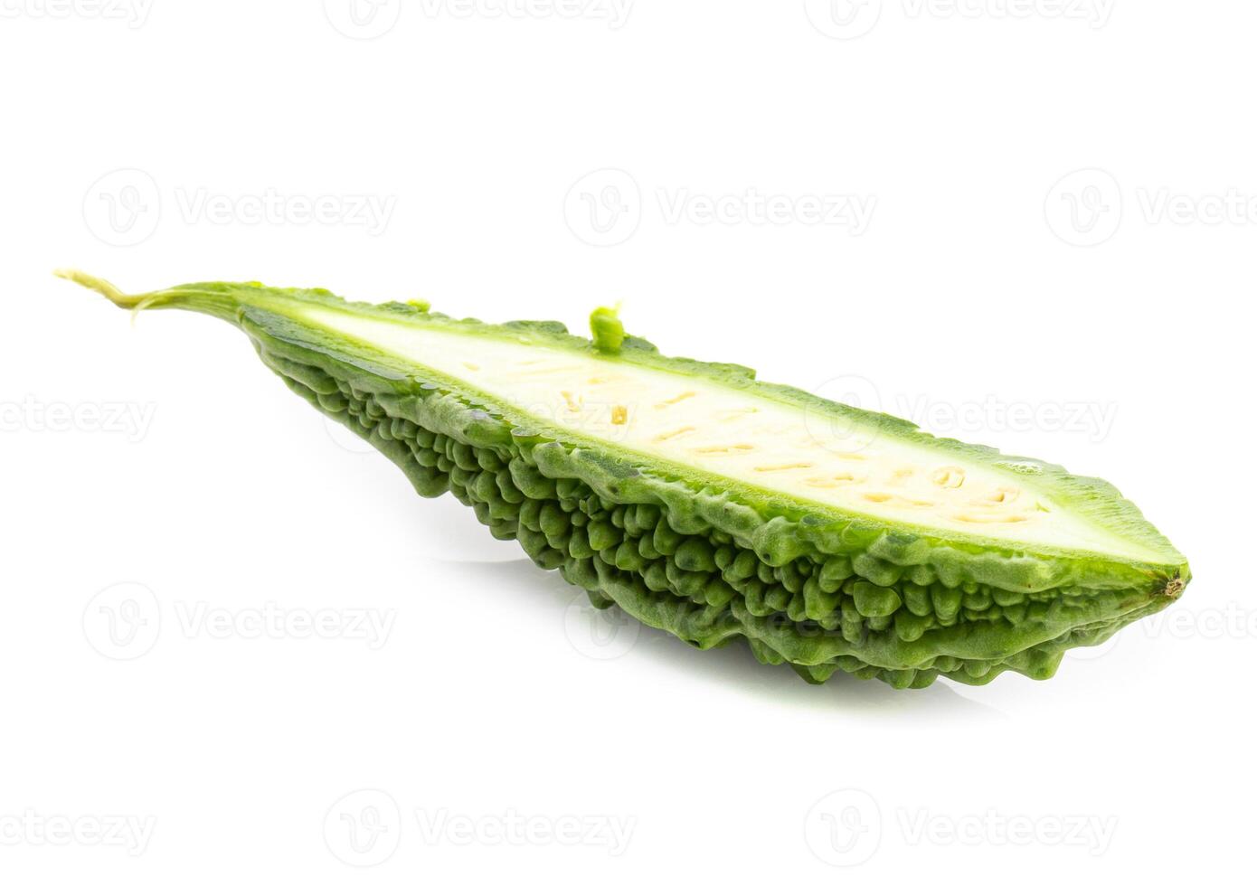 Fresh bitter gourd Bitter cucumber or bitter melon with cut slice isolated on white background. photo