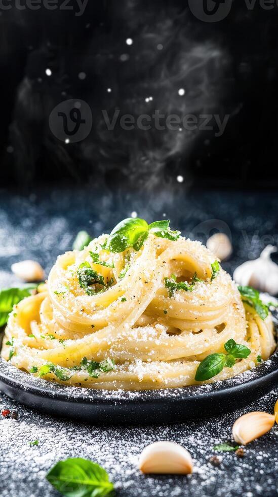 Flavorful plate of pasta with garlic and fresh parsley served elegantly on a white tablecloth with utensils photo
