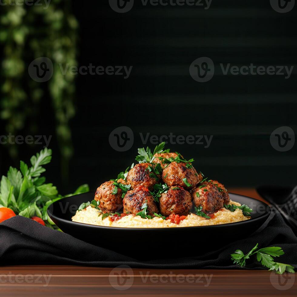 A plate of flavorful meatballs accompanied by a generous serving of steamed rice for a balanced meal photo