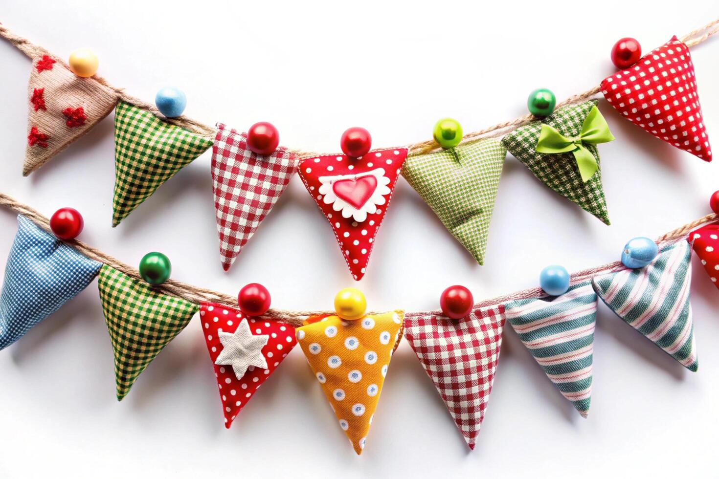 Colorful fabric bunting with bright patterns and cheerful design, perfect for festive events and home decor on a white background photo