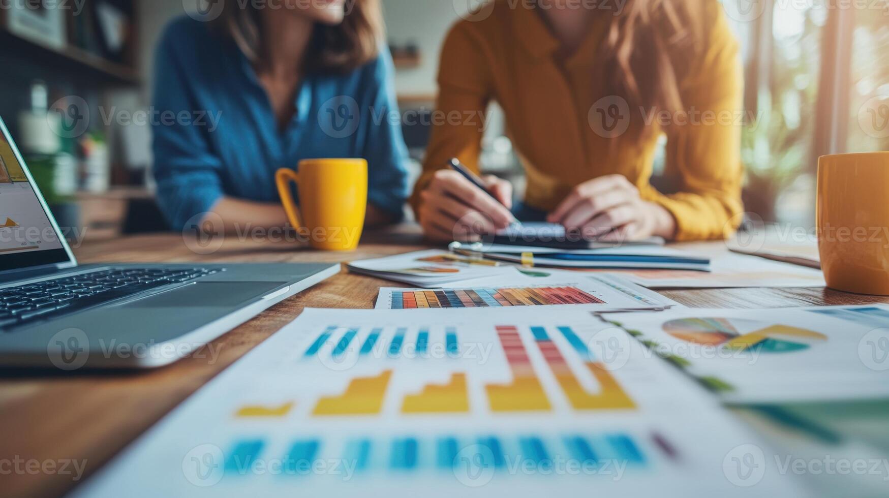 Business people working. Laptop and charts on table. Coworkers plan together. Team discuss project. Women studying reports. Office with data. Analyzing graphs and charts. photo