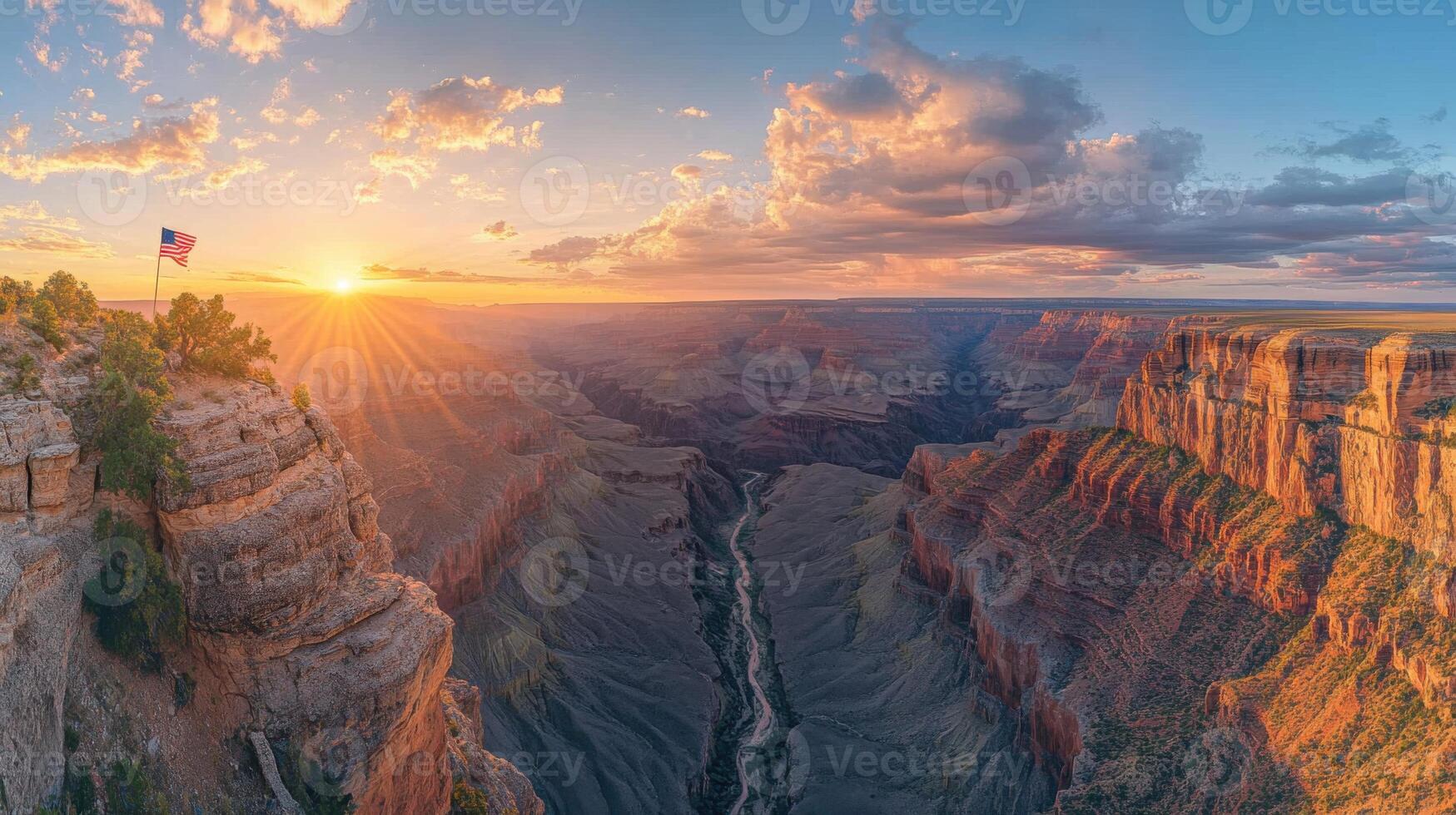 Grand canyon view at sunset. Cliffs and valley landscape. Sky with clouds and sun shining. Nature scene with flag on rock. photo