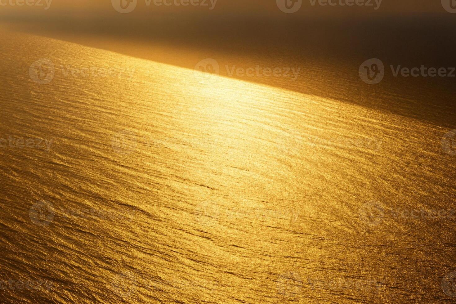 Elegant golden glow with subtle textured pattern, warm metallic sheen on smooth surface, abstract gold background photo