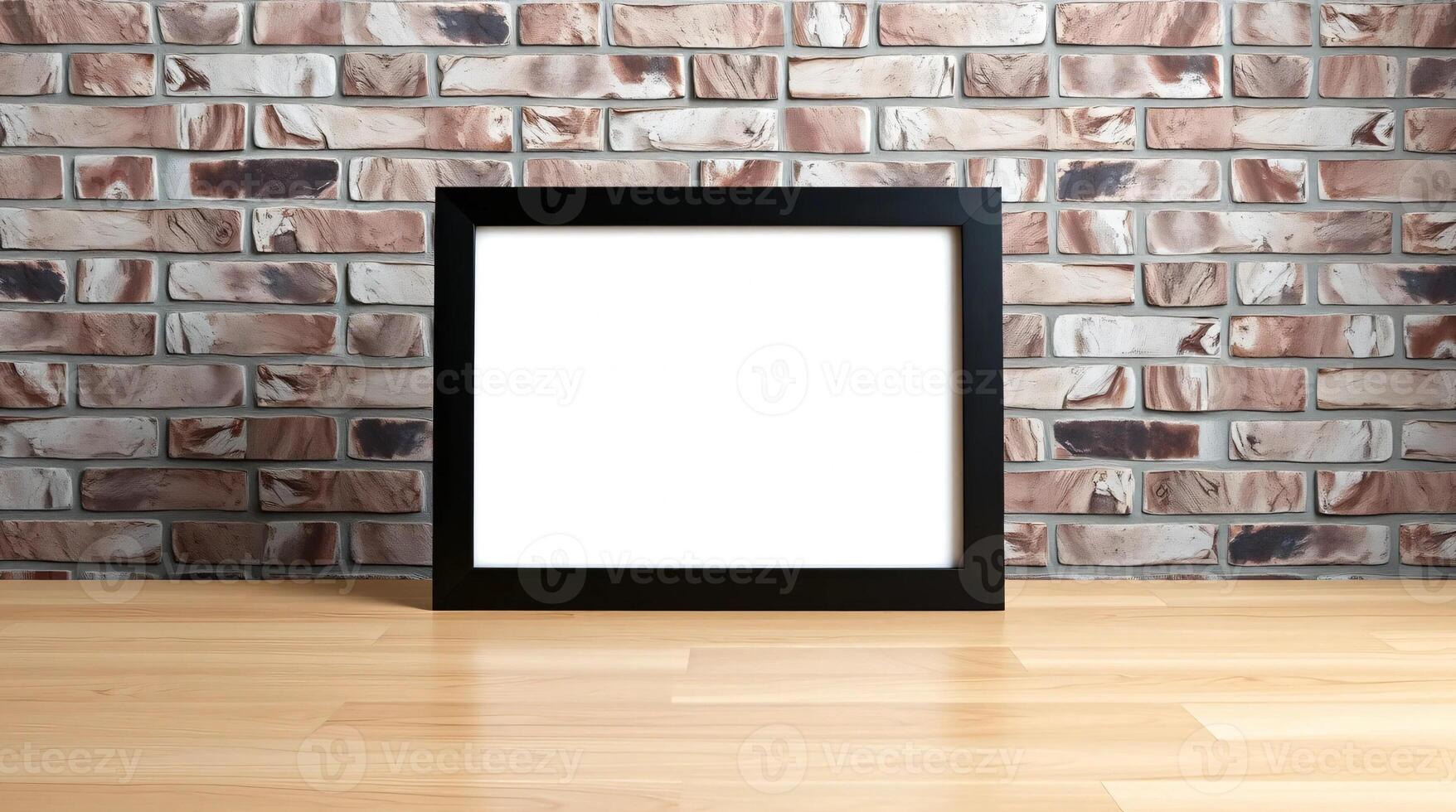 A blank white frame on a wooden floor in front of a brick wall photo