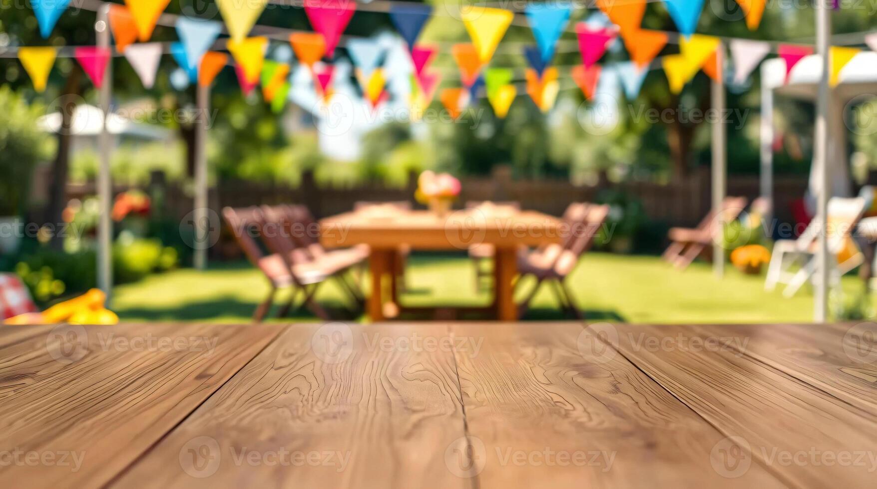 Wood table top with bunting flags in the background photo