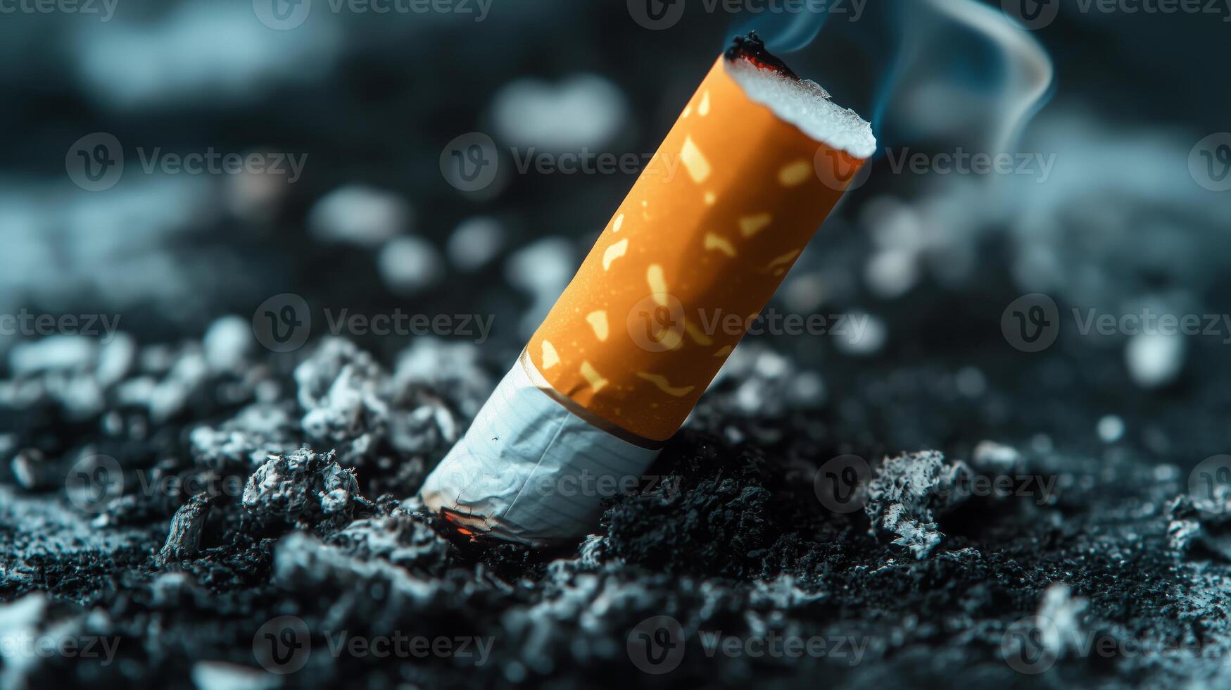 A cigarette sitting on top of a pile of ash photo