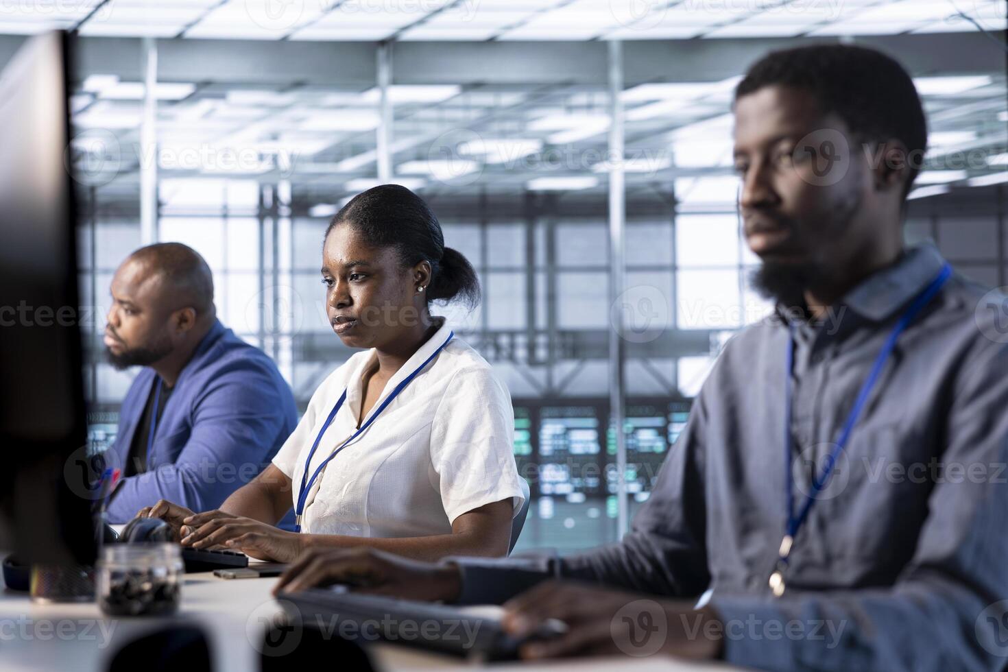 Team of programmers in data center running system diagnostic tests on computer to fix problems. Coworking employees deploying and error checking utilities on PC to fix network issues performance photo