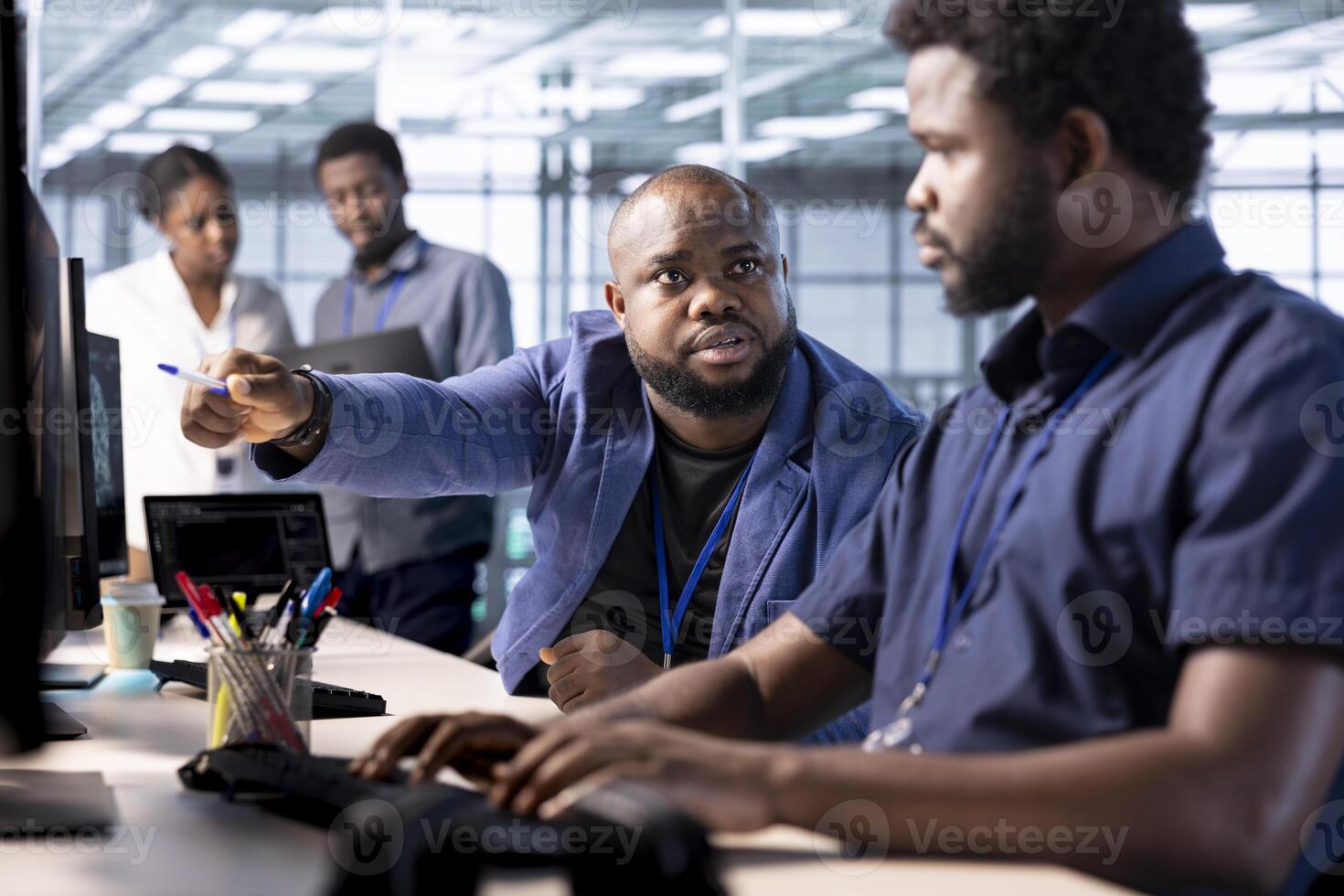 Manager admonishing data center engineer using programming languages to construct algorithms and build applications. Server hub supervisor scolding worker unable to properly optimize code photo