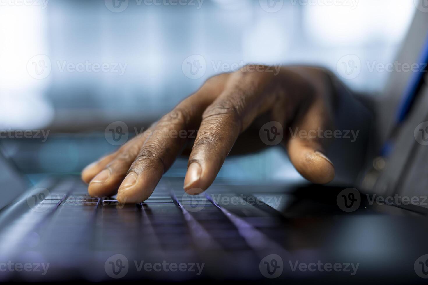 Technician in data center typing on laptop keyboard, developing disaster recovery plans. Close up of worker in server hub testing failover scenarios using notebook, protecting data during disruptions photo