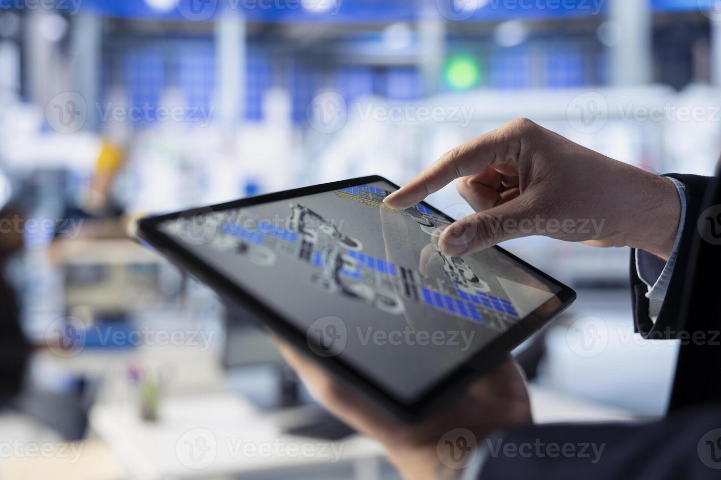 Solar panels manufacturing plant staff member developing new photovoltaic materials and technologies using tablet. Close up of photovoltaics factory expert conducting experiments on touchscreen device photo