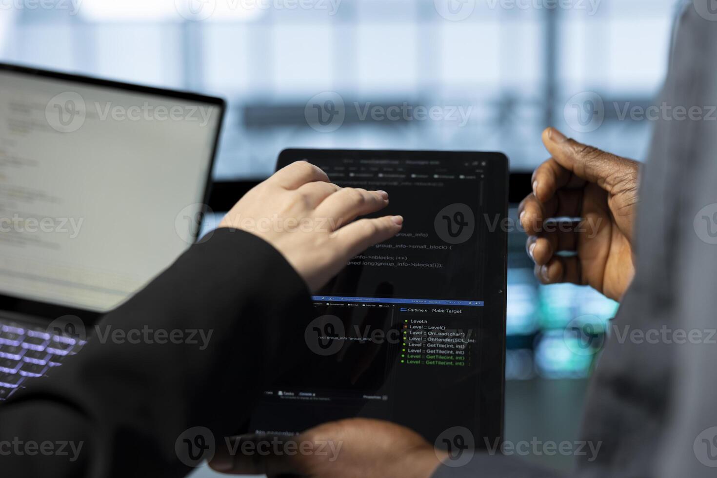 Engineers in data center using laptop and tablet, employing machine learning models. Close up of employees using devices to fulfill infrastructure needs, allocating resources efficiently photo