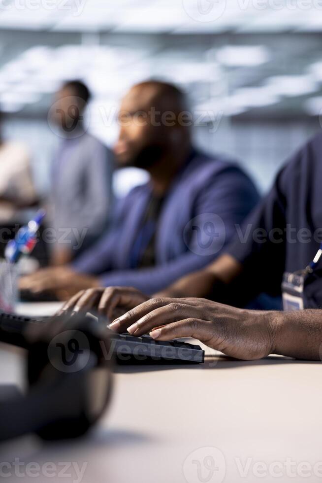 Data center worker typing on keyboard, using programming languages to construct algorithms and build applications. Close up of server hub IT employee writing and optimizing code photo
