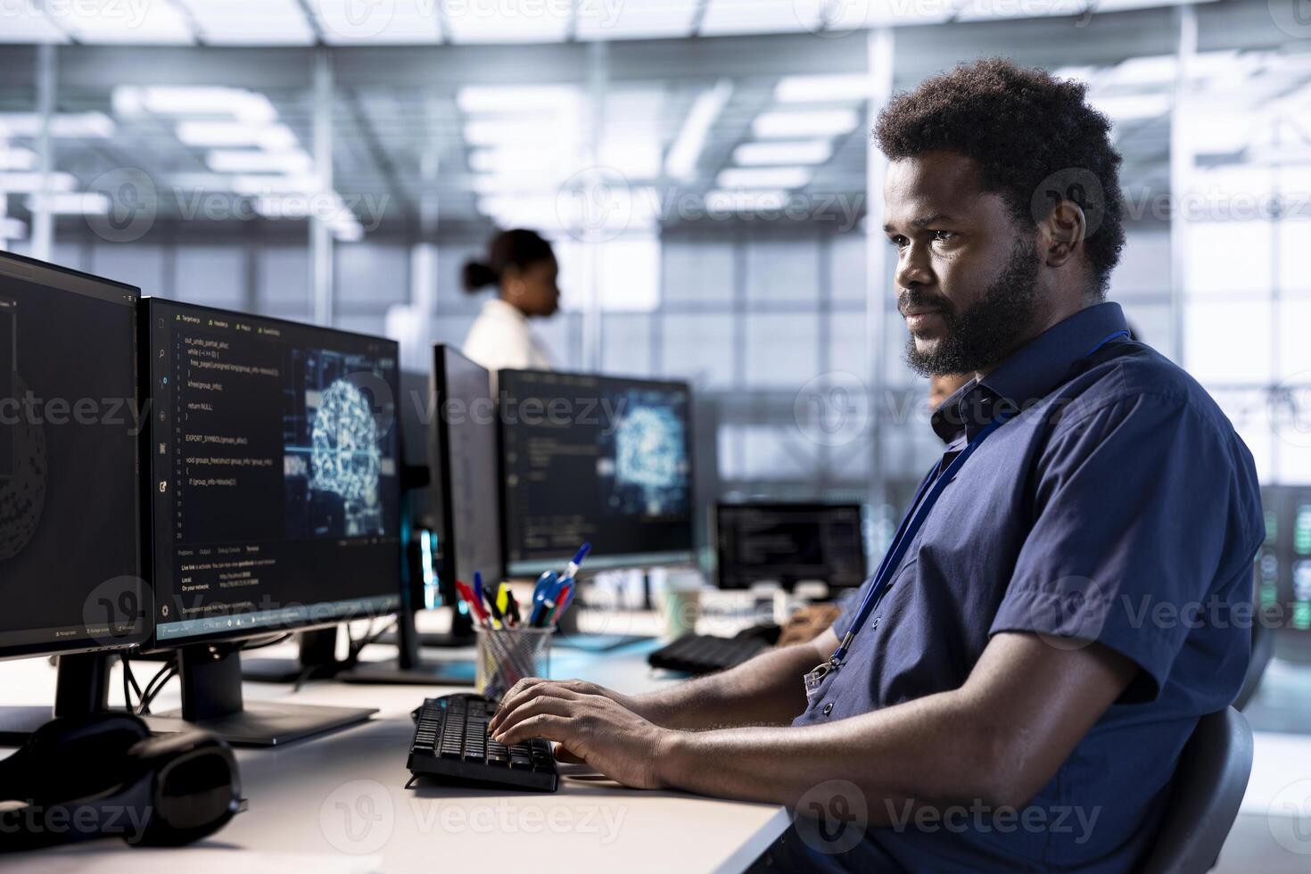 IT specialist in server room creating AI systems high performance computing engine on PC. African american man in data center developing artificial intelligence with cognitive abilities photo