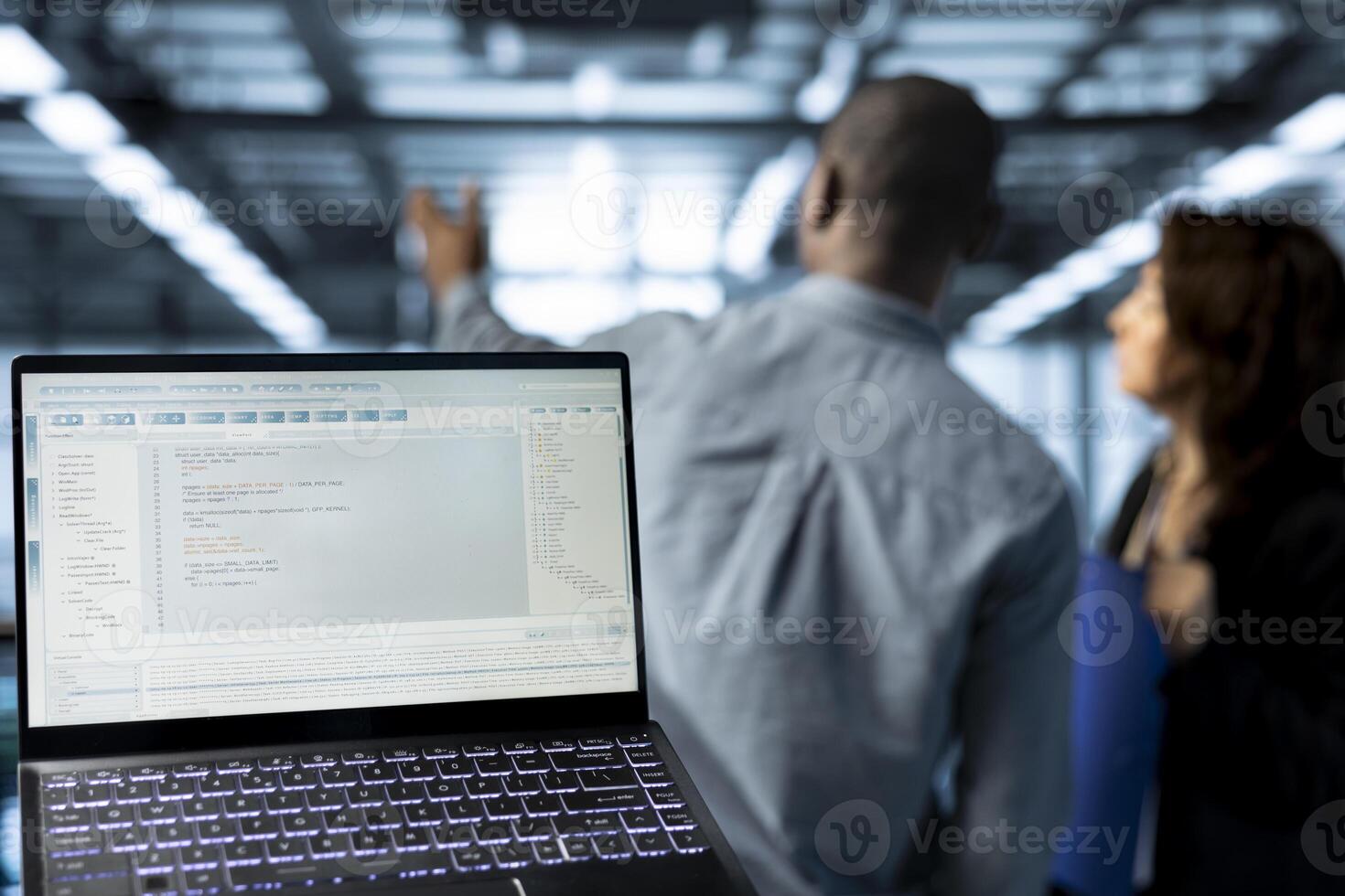 Lines of code on laptop display used by data center technicians to execute security patches. Close up of programming language on notebook used by server hub employees scanning equipment photo