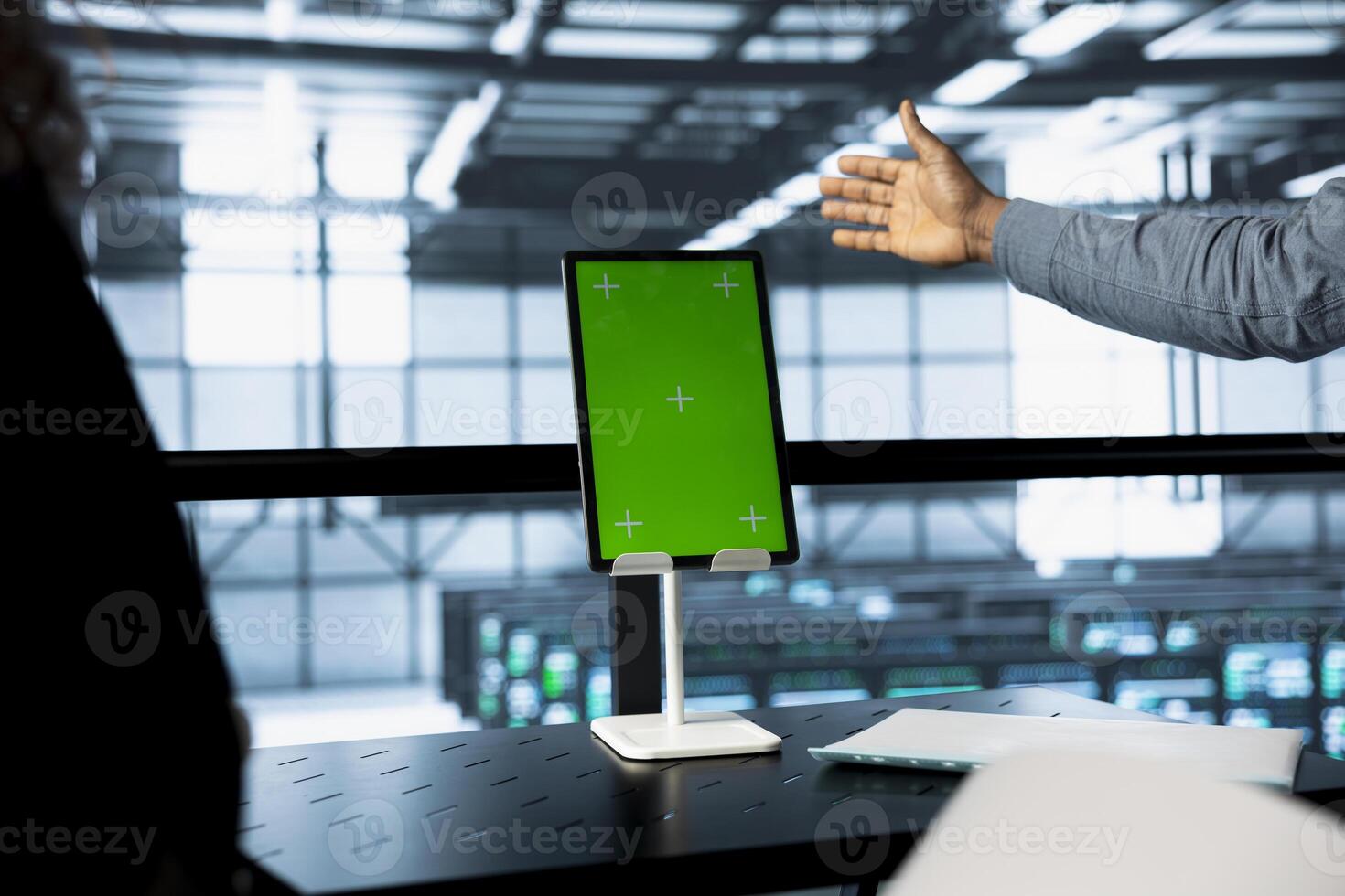 Engineers using isolated screen tablet in data center, managing server virtualization. Workers using mockup device in server room, sustaining long term infrastructure reliability photo