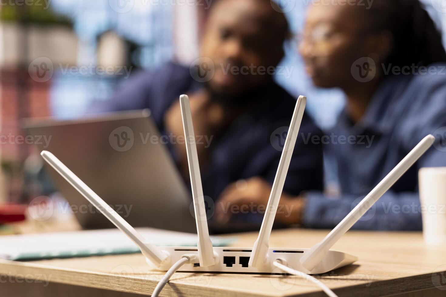 Black couple at home examine the modem setup and troubleshooting online guides, working together to fix Wi Fi router and restore their internet connection for remote freelance tasks. photo
