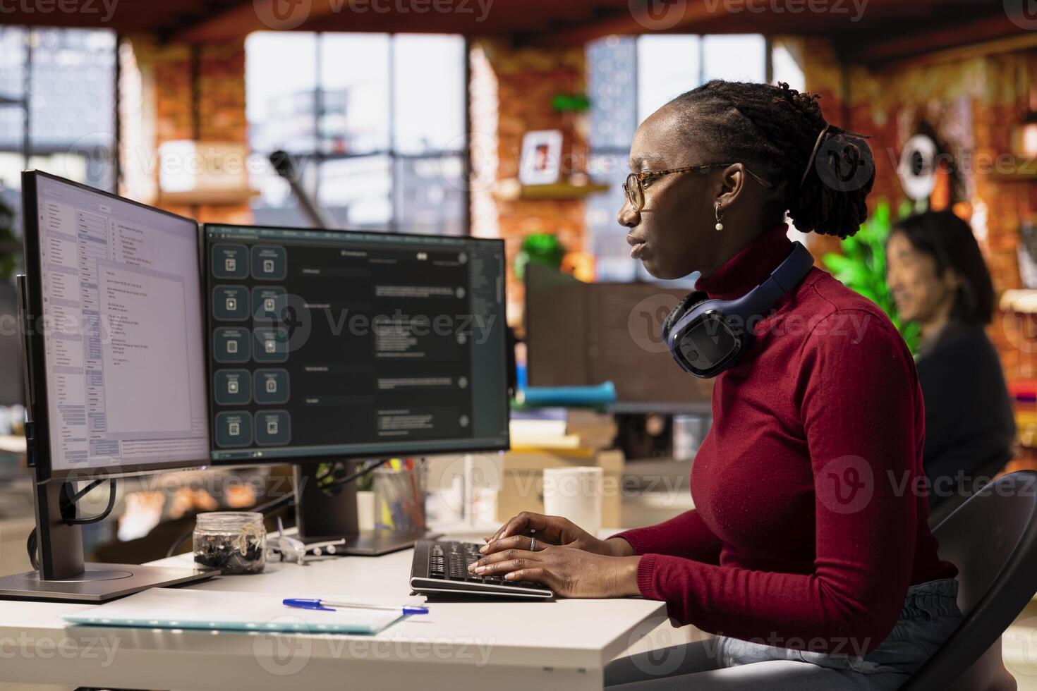 IT engineer in startup office using large language model on computer to get help with coding project. IT expert interacting with AI LLM chatbot on PC in software development business company photo
