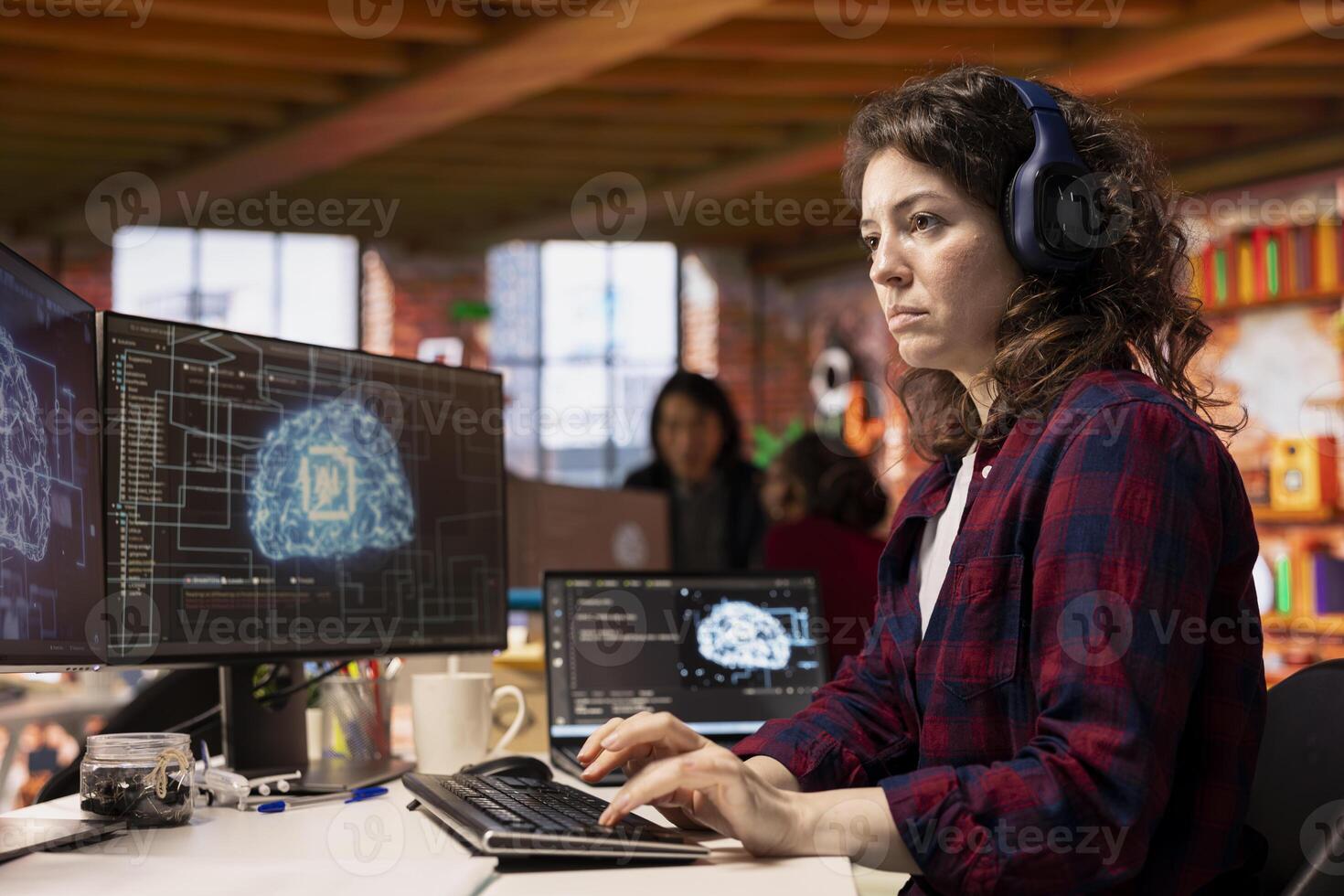 IT engineer wearing headphones works in AI tech agency providing custom software development services. IT expert listening music, using artificial intelligence technology to streamline coding process photo
