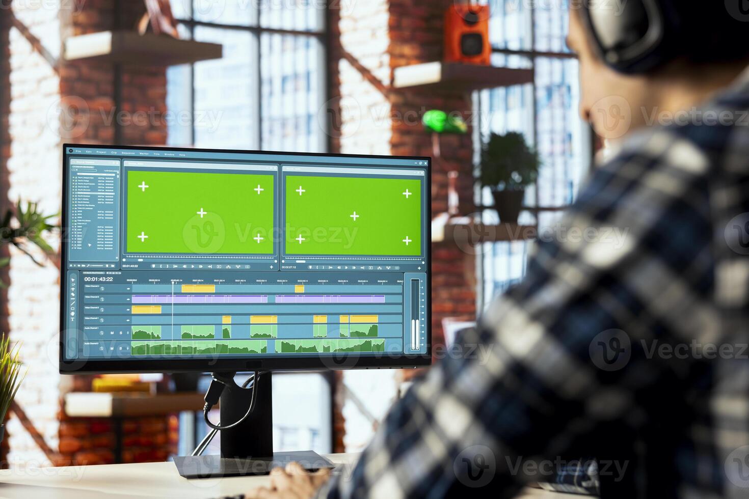 editor trimming segments, working on promotional clip using chroma key computer. Close up of videographer splicing film pieces, editing using professional software on isolated screen PC photo