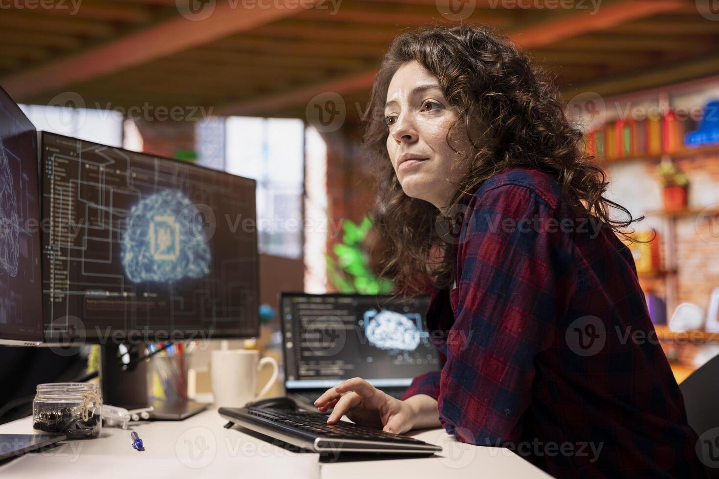 System administrator in startup office coding advanced AI algorithm and machine learning models enhancing automation. IT specialist using PC in artificial intelligence Silicon Valley workplace photo