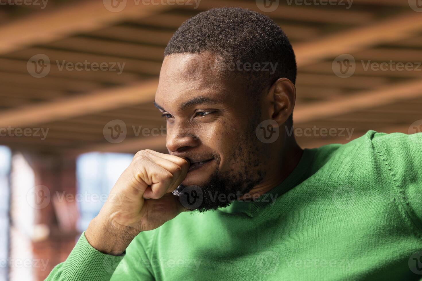 Smiling man in home office desk feeling proud after seeing he achieved sales target on laptop screen. Smug remote employee rejoicing after receiving promotion at work, reading email, close up photo
