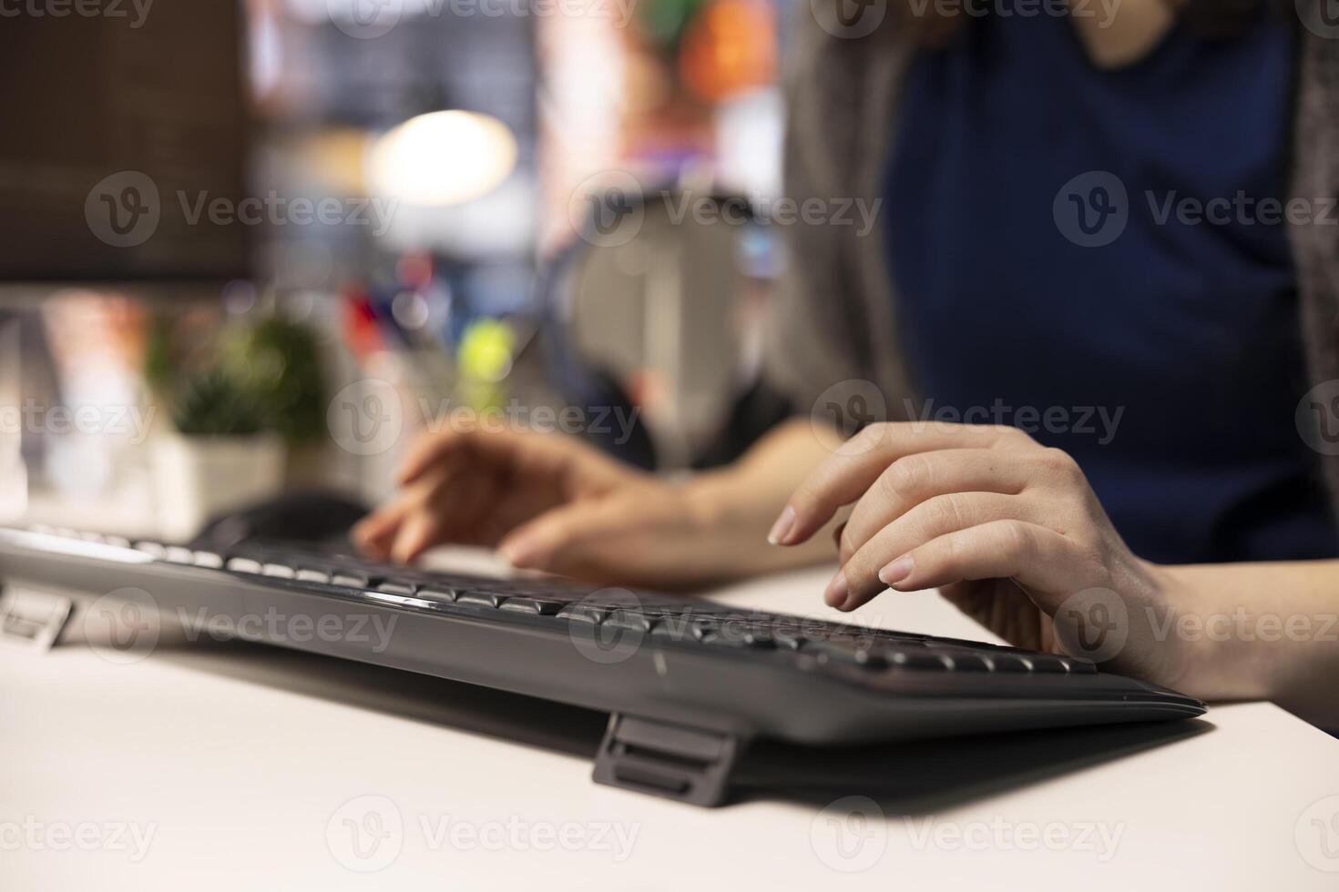 Technician at the office looking at UI on computer monitor and executing programming code. IT freelance worker using coding application to write and test code in modern apartment. Close up. photo