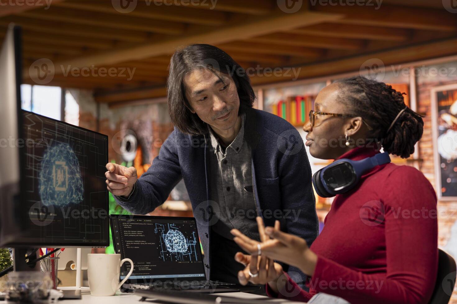 AI startup office chief technology officer overseeing programmer building application. Senior manager assisting worker in artificial intelligence software development agency, offering advice photo