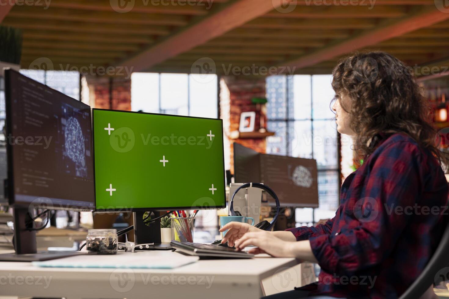 Computer scientist using isolated screen PC working with artificial intelligence technology in tech startup. Chroma key computer monitor used by IT specialist developing AI systems in office photo