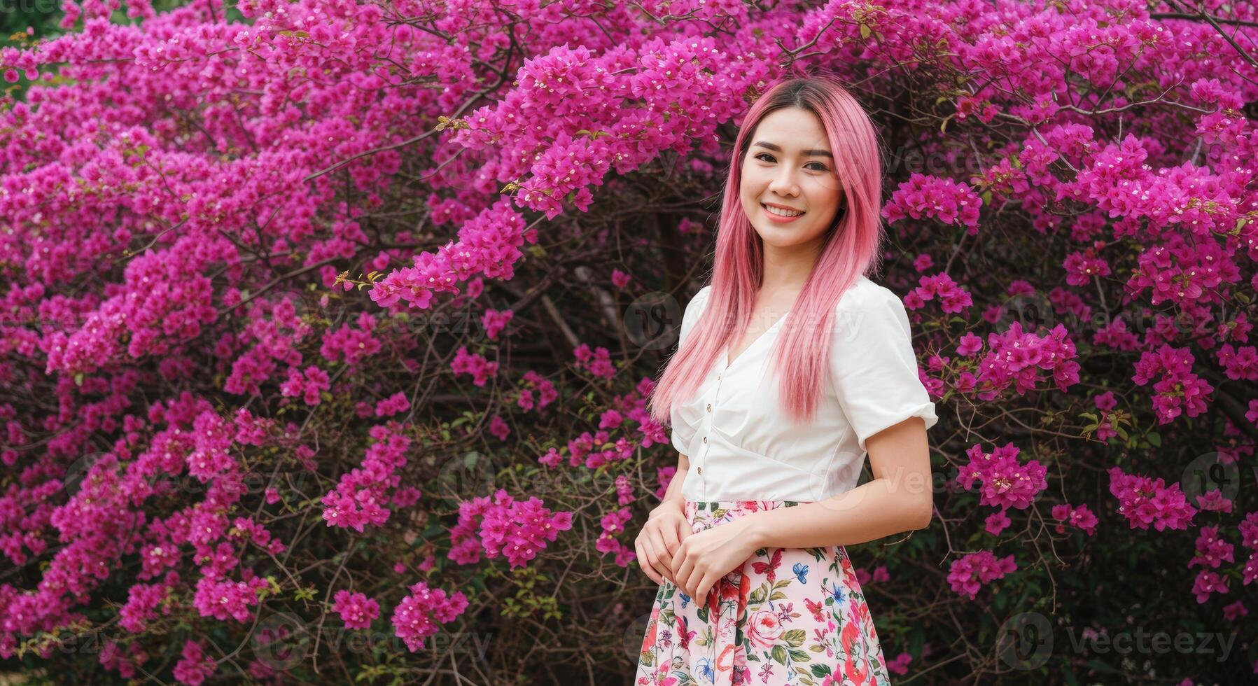 Thai Woman with Pink Hair in White Top Enjoying Colorful Flower Garden photo