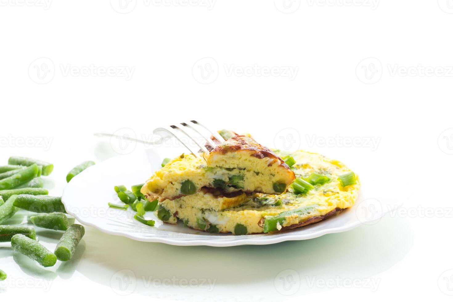 Dietary delicious breakfast.Egg omelette with herbs and vegetables isolated on white background photo