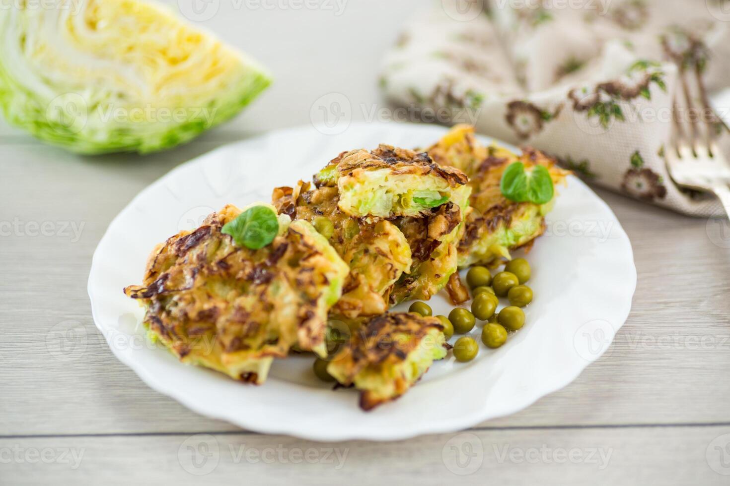 Quick and easy dinner.vegetable cutlets from early cabbage with peas photo