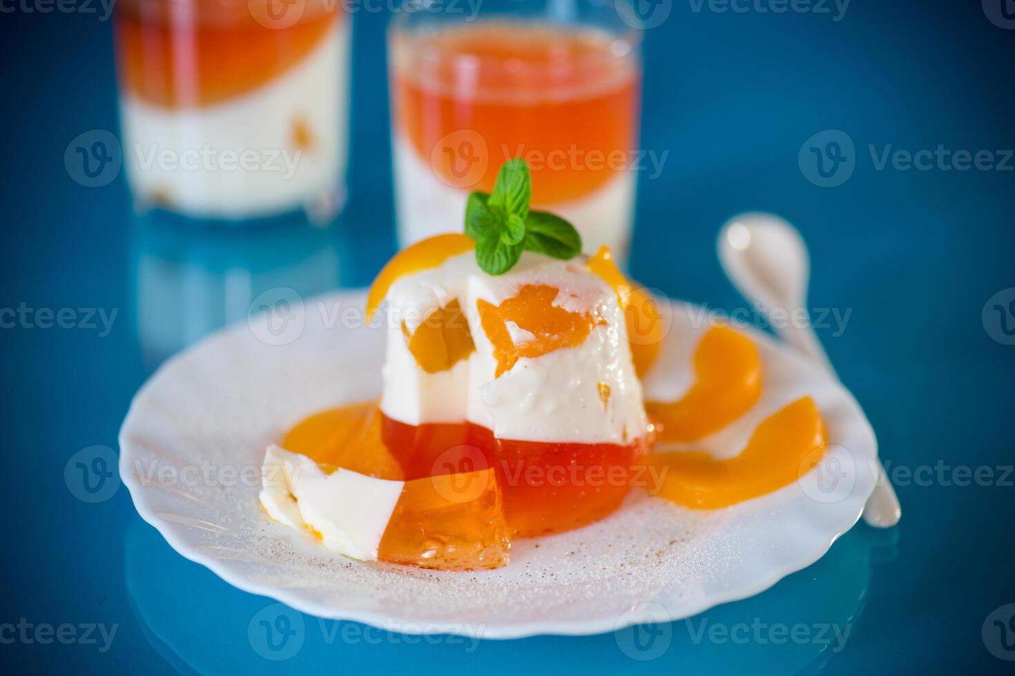 Jelly desserts.Portioned jelly dessert with yogurt cream and fruits photo