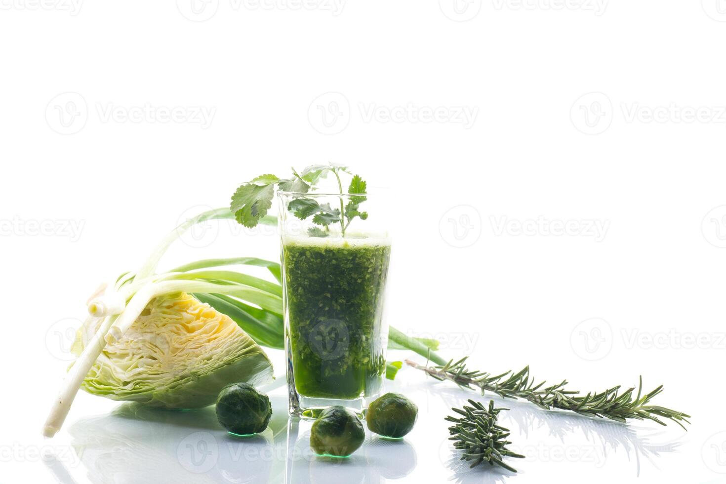 Refreshing green smoothie with fresh vegetables and herbs photo