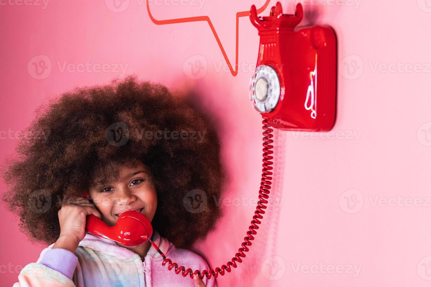 Black girl speaking on telephone in studio photo