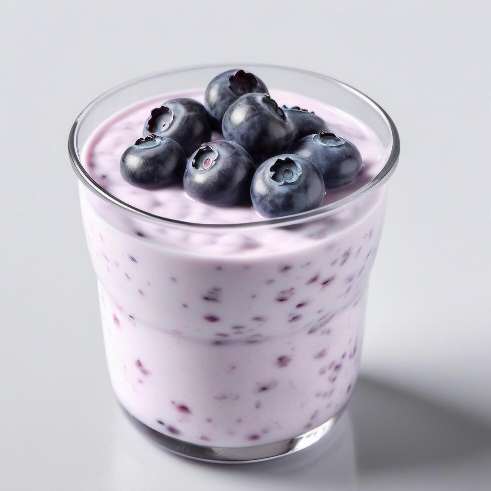 Jar of fresh blueberry yogurt for snack. Closeup food image isolated on white background. Packaging design element, copy space photo