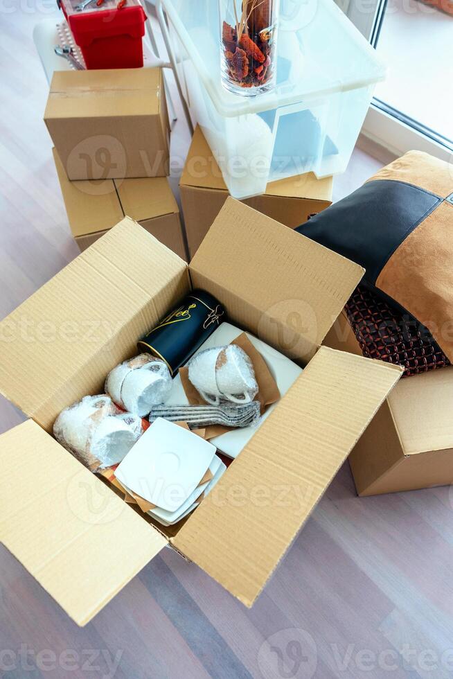 Living room with stack of moving boxes photo