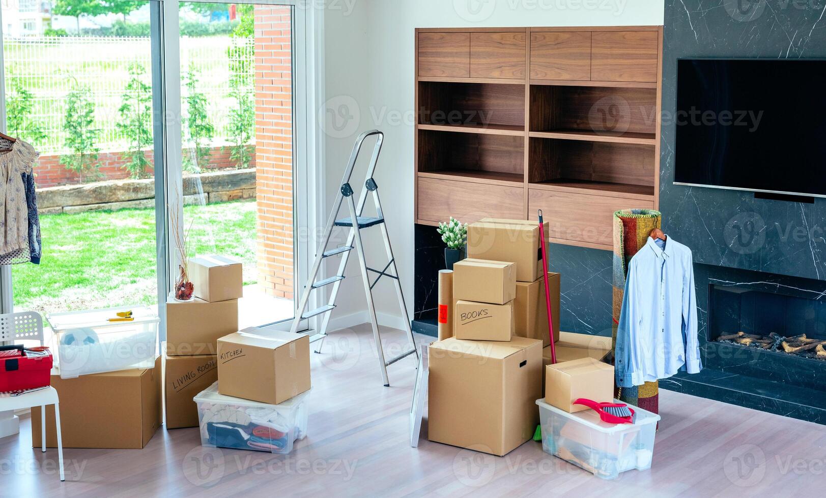 Living room with stack of moving boxes photo