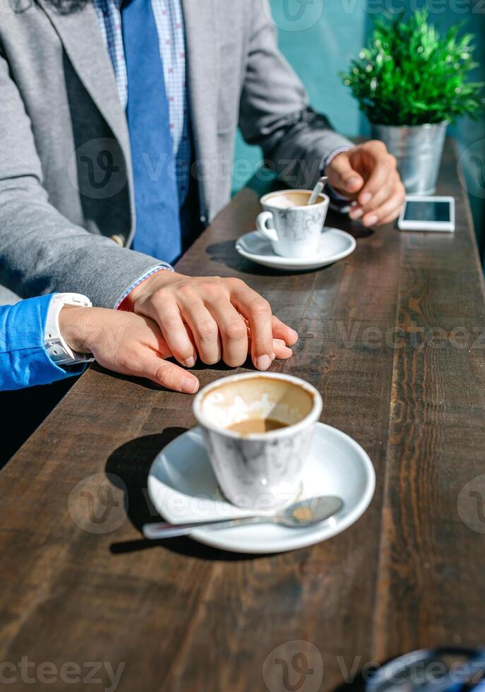 Couple of coworkers holding hands photo