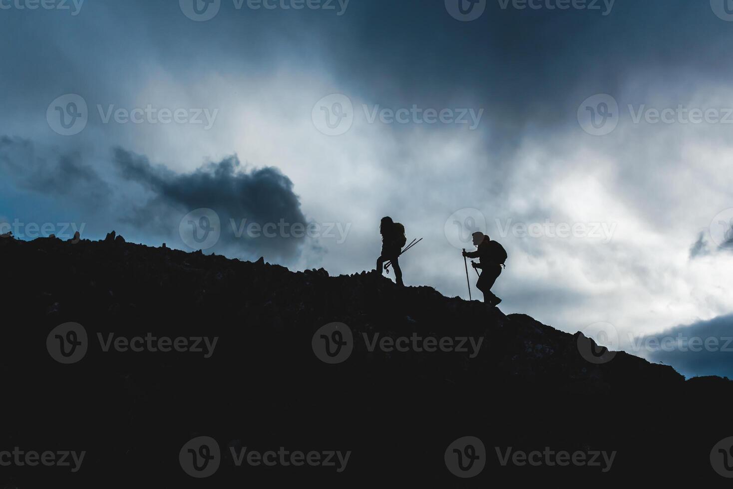 mountaineers hiking in the mountains photo
