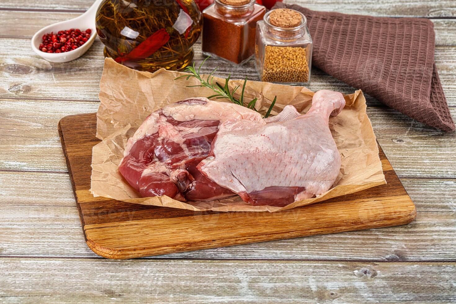 Raw meat on a cutting board with spices and spices photo